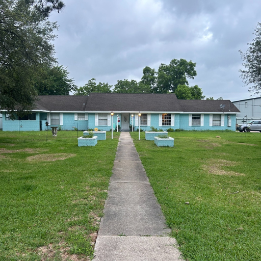 Delasandri Lane sober living home exterior in Kemah TX — turquoise ranch-style