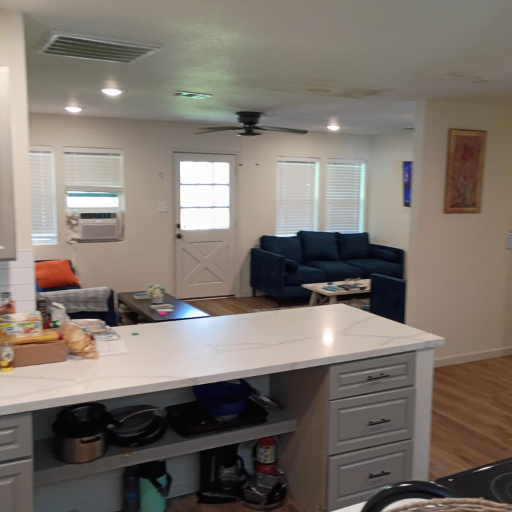Open-plan view from kitchen island into the living room at Idaho Drive