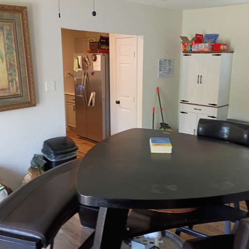 Dining area with dark round table and chairs at 2003 Idaho Drive League City