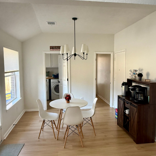 Dining area with table and in-house laundry at Vantage Pointe