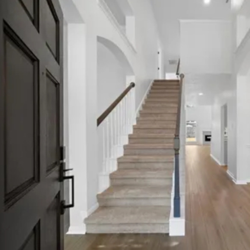 Grand foyer and staircase inside Vantage Pointe home